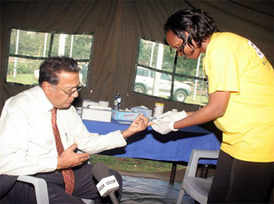 Kenya businessman and Dr. Manu Chandaria visits a mobile clinic