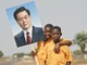 Liberian boys hold up a poster of Hu Jintao, China's president