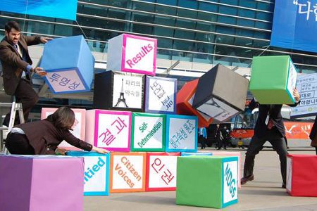 A stunt by Oxfam outside the venue of the Fourth High-Level Forum on Aid Effectiveness