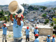 Locals work to remove rubble from a neighborhood in Port-au-Prince