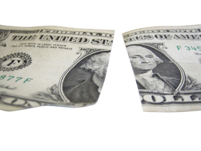 A dollar bill cut in half
