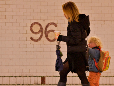 A mom rushes to work with her kid in tow