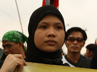 A Muslim woman joins a protest in Manila, Philippines