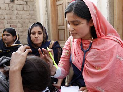 Doctor examines a patient in Pakistan